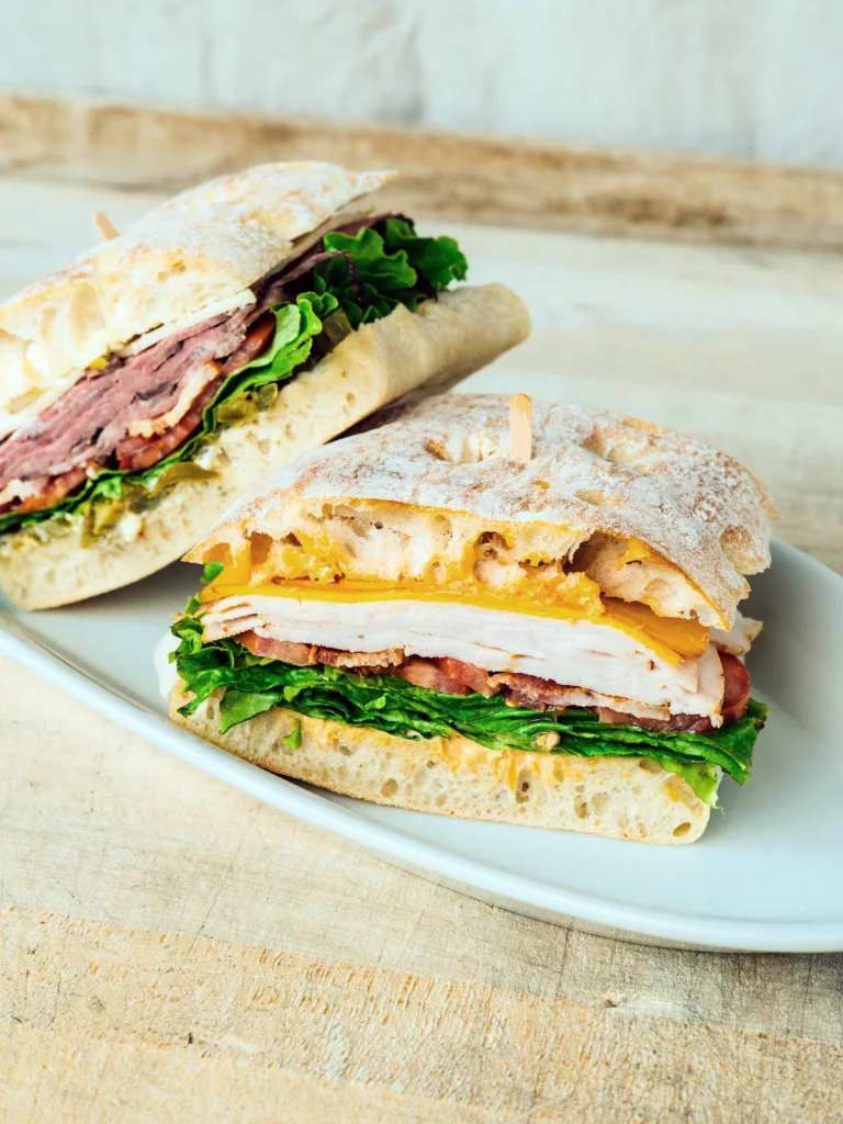 Handmade sandwiches made with in-house ingredients, sliced deli meats, and freshly baked breads